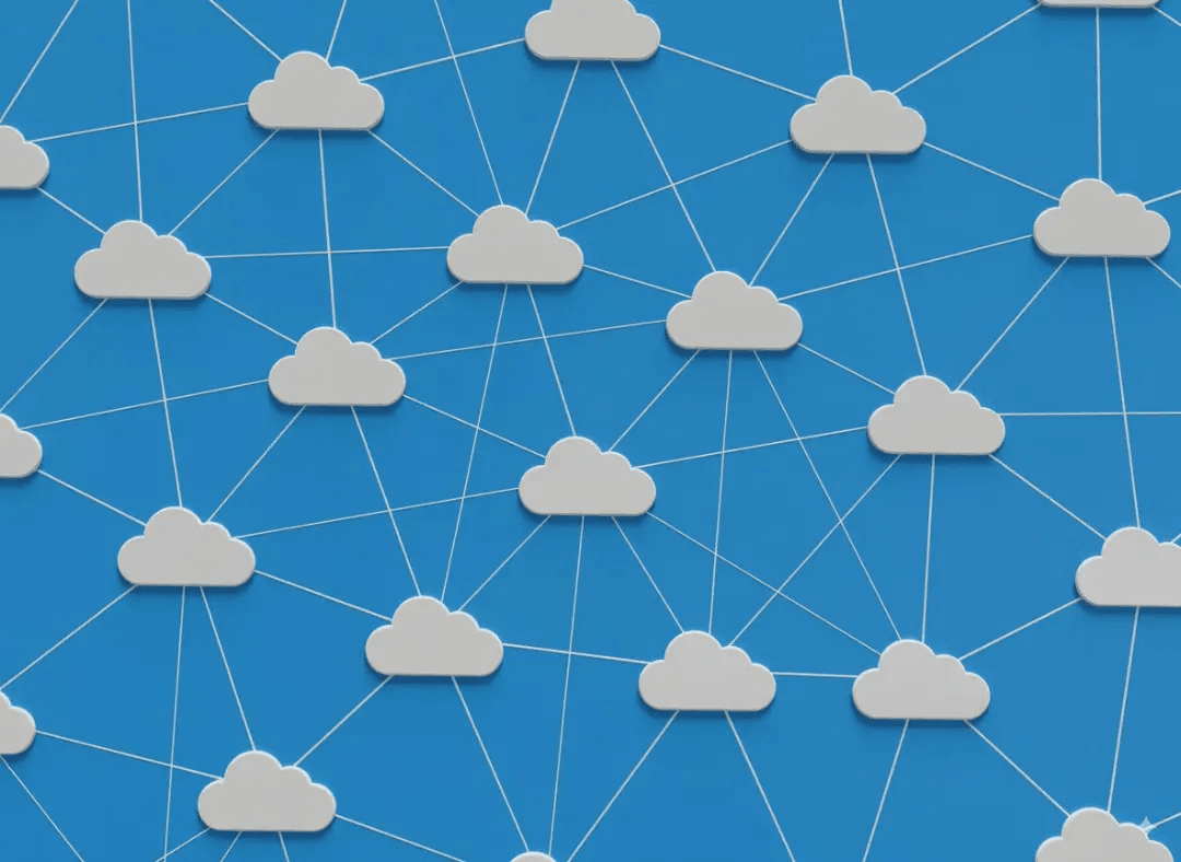 A diagram illustrating the concept of cloud computing, with multiple cloud icons connected in a network on a blue background.