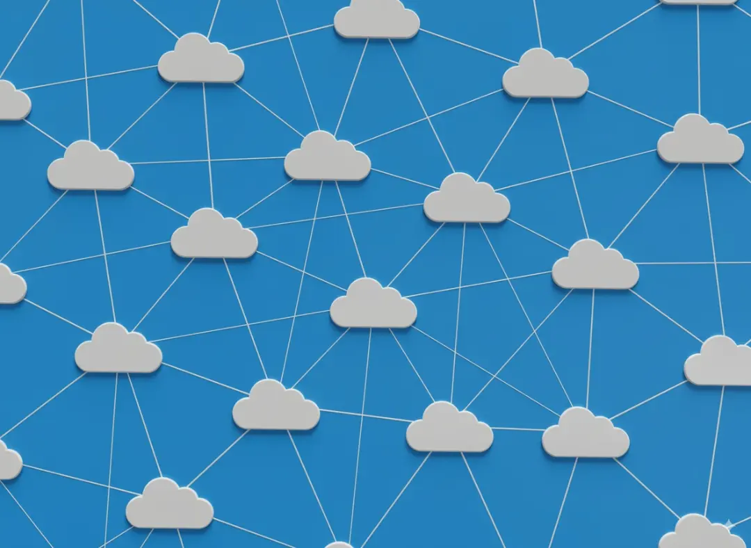 A diagram illustrating the concept of cloud computing, with multiple cloud icons connected in a network on a blue background.